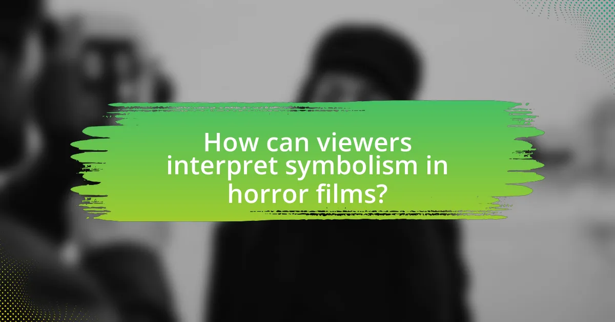 How can viewers interpret symbolism in horror films?